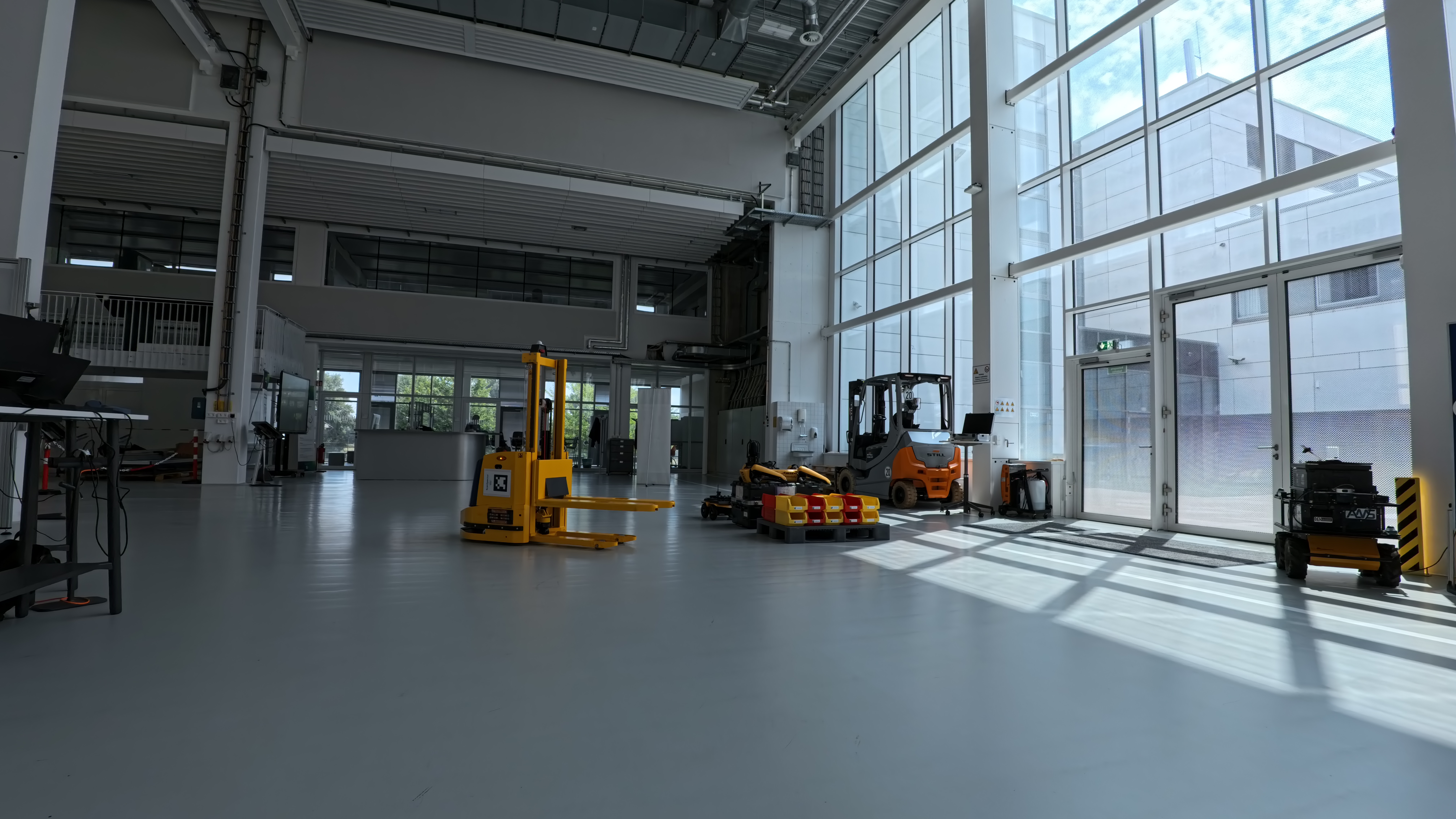 Autonomous mobile robots in a bright industrial facility