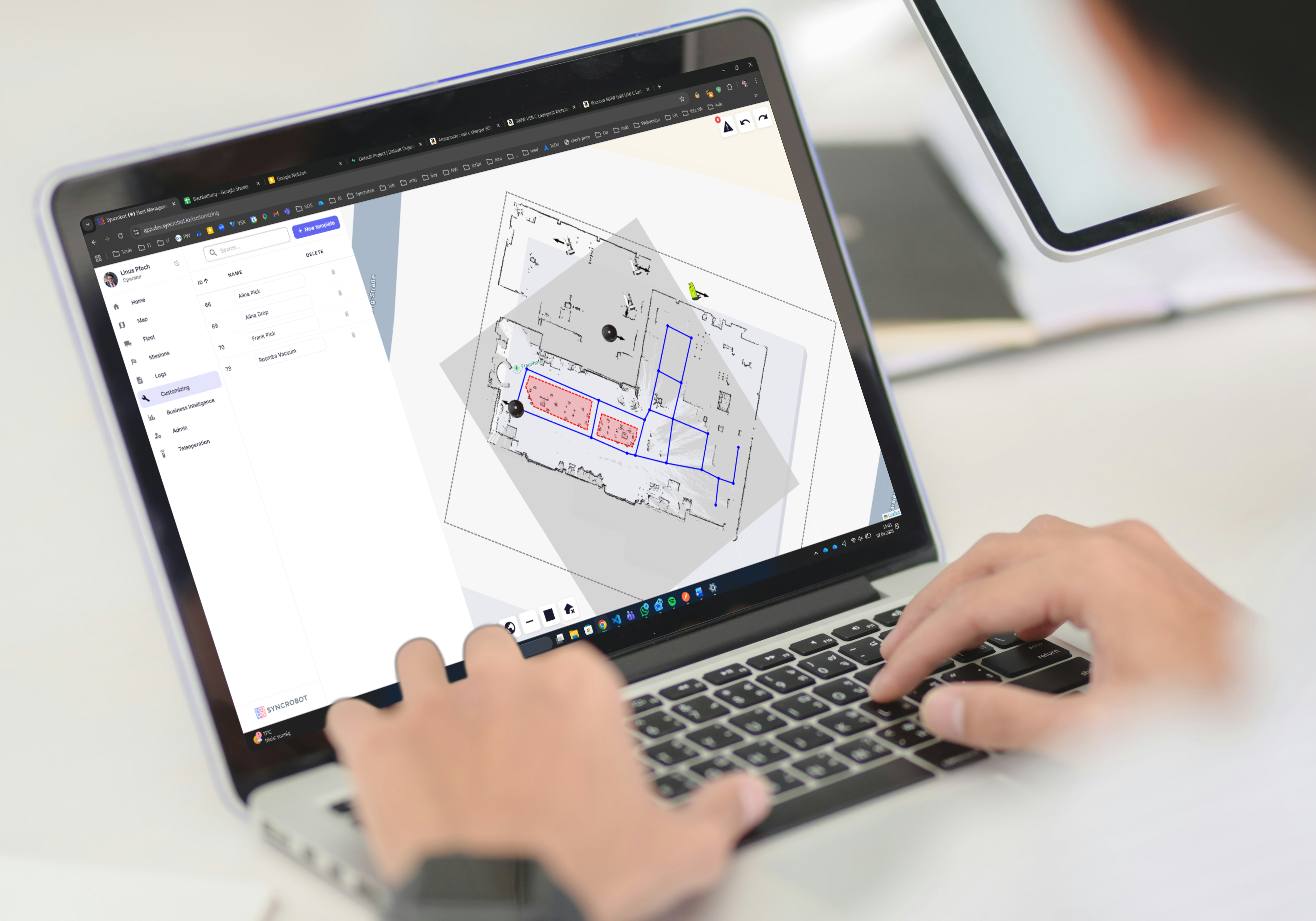 SyncroBot fleet management platform on a laptop
